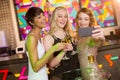 Female friends taking selfie from mobile phone while having champagne Royalty Free Stock Photo