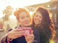 Female friends two women taking selfie having fun during weekend getaway