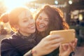 Female friends two women taking selfie during weekend getaway Outdoors Royalty Free Stock Photo