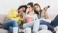 Female friends watching melodrama film at home Royalty Free Stock Photo