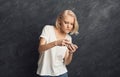 Female gambler playing on smartphone Royalty Free Stock Photo