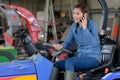 female garden tractor mechanic