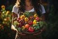 Female gardener hands holding harvested vegetables in the garden. Mature farmer with a bunch of self-grown goods. Growing own