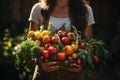 Female gardener hands holding harvested vegetables in the garden. Mature farmer with a bunch of self-grown goods. Growing own