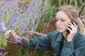 Female gardener receiving negative news on telephone Royalty Free Stock Photo