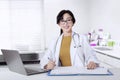 Female general doctor smiling in the office