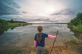 Female girl standing by a pond at sunrise Royalty Free Stock Photo