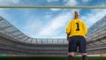 Female goakeeper standiing on goal on crowded stadium Royalty Free Stock Photo