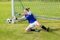 Female goalkeeper saving a goal