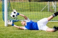 Female goalkeeper saving a goal