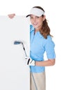 Female golfer with blank board