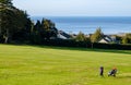 Female golfer in evening sunlight at Penmaenmawr Golf course Royalty Free Stock Photo