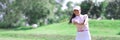 Female golfer hits ball with club closeup Royalty Free Stock Photo