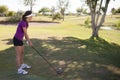 Female golfer ready to swing Royalty Free Stock Photo