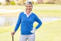 Female golfer smiling at camera Royalty Free Stock Photo