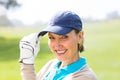 Female golfer smiling at camera Royalty Free Stock Photo