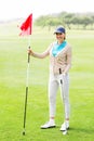 Female golfer smiling at camera Royalty Free Stock Photo