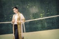 The female graduation portrait in academic gown is looking forwa Royalty Free Stock Photo