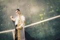 The female graduation portrait in academic gown is looking forwa Royalty Free Stock Photo