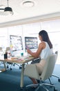 Female graphic designer using digital tablet at desk in a modern office Royalty Free Stock Photo