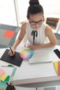 Female graphic designer using graphic tablet at desk in a modern office Royalty Free Stock Photo