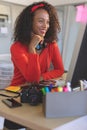 Female graphic designer working on desktop pc at desk in a modern office Royalty Free Stock Photo