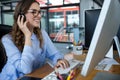 Female graphic designer working over computer at desk Royalty Free Stock Photo