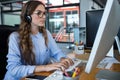 Female graphic designer working over computer at desk Royalty Free Stock Photo