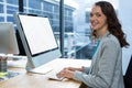 Female graphic designer working over computer at desk Royalty Free Stock Photo