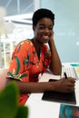 Female graphic designer working on graphic tablet at desk in office Royalty Free Stock Photo