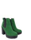 Female green suede boots on white background, isolated product, top view. heeled shoes