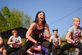 Group Empowerment: Female Piloxing Instructor Guides an Energetic Pose in the Great Outdoors