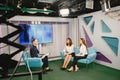Tv host on talk show with two women guests