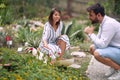 Female guide telling about beautiful plants to a male visitor Royalty Free Stock Photo