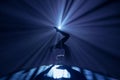 Female gymnast on dark background of studio with backlight. Acrobatic girl performing handstand. Modern choreography and Royalty Free Stock Photo