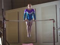 Female gymnast practicing gymnastics on the horizontal bar Royalty Free Stock Photo
