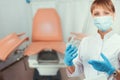 Female gynecologist in protective mask