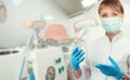 Female gynecologist in protective mask