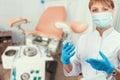 Female gynecologist in protective mask