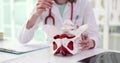 Female gynecologist shows location of pelvis with muscles