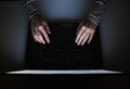 Female Hacker  typing in a keyboard on a laptop Royalty Free Stock Photo