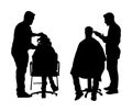 Female hairdresser with client lady in hairdress beauty salon . Woman in barber`s chair getting haircut by hair stylist.