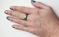 Female hand with accessories ring close up on a white background Royalty Free Stock Photo