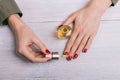 Female hand applied oil on the nails Royalty Free Stock Photo