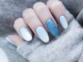 Female hand beautiful fashion blue design stylish ombre acrylic manicure, sweater, winter Royalty Free Stock Photo
