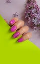 Female hand beautiful elegant manicure flower lilac cosmetic minimalism