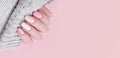 Female hand beautiful manicure fashion color relax nail stylish sweater