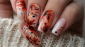 Female hand with beautiful manicure and orange nail polish. Nail art design