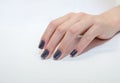 Female hand with beautiful manicure and painted nails isolated on white. Close-up. Royalty Free Stock Photo