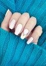 Female hand beautiful manicure sweater Royalty Free Stock Photo